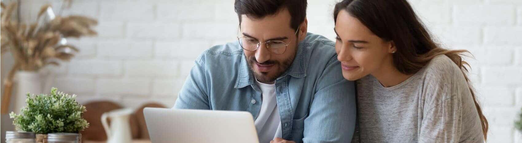 Couple Online Shopping for a Vehicle