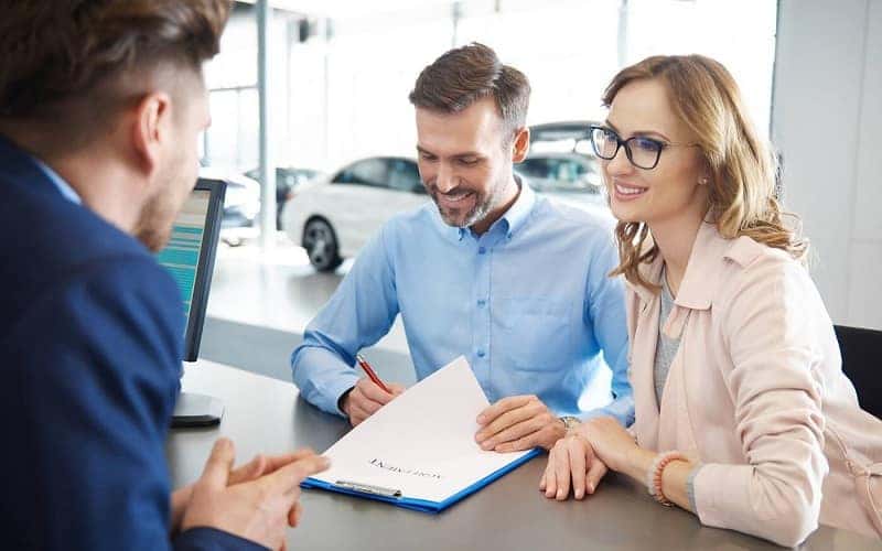 Customers talking with Mazda Finance specialist
