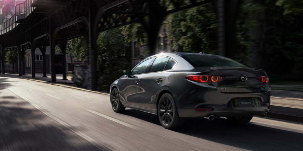 Rear view of a parked pre-owned Mazda3