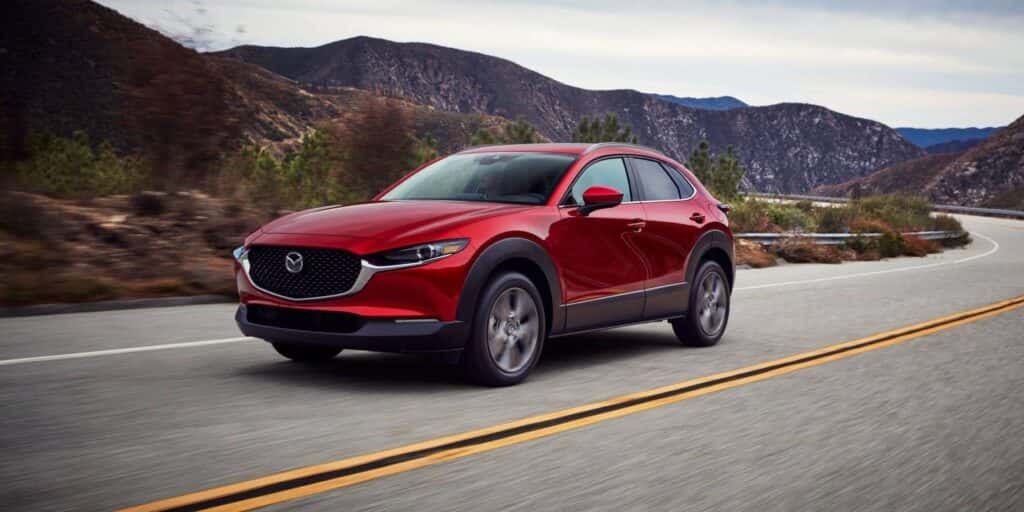 A red 2025 Mazda CX-30 on the road