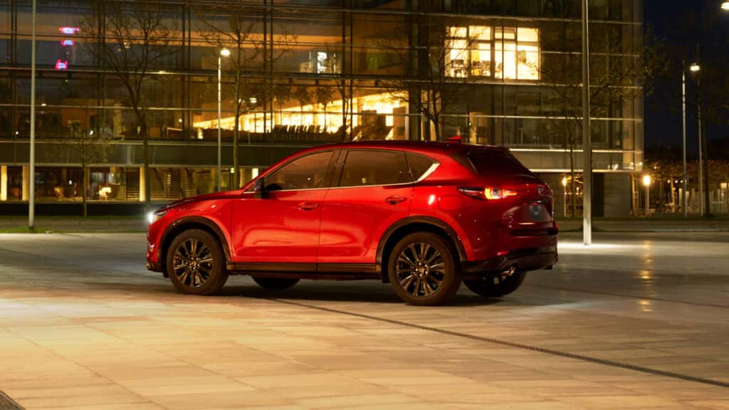 Red 2025 Mazda CX-5 driving at night