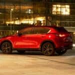 Red 2025 Mazda CX-5 driving at night