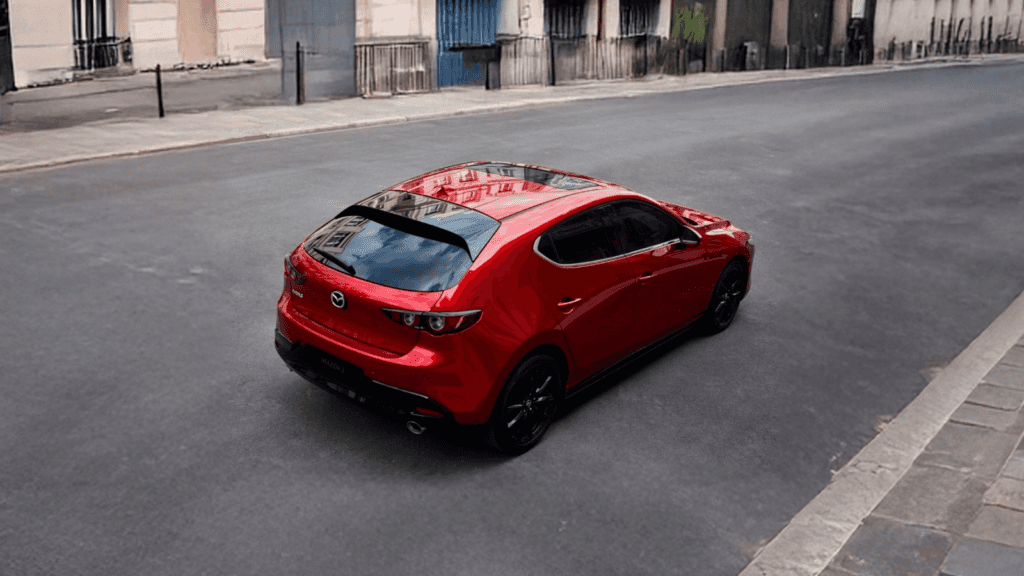 Rearview of the 2026 Mazda3 Hatchback on the road