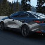 Pre-owned Mazda vehicle on the road