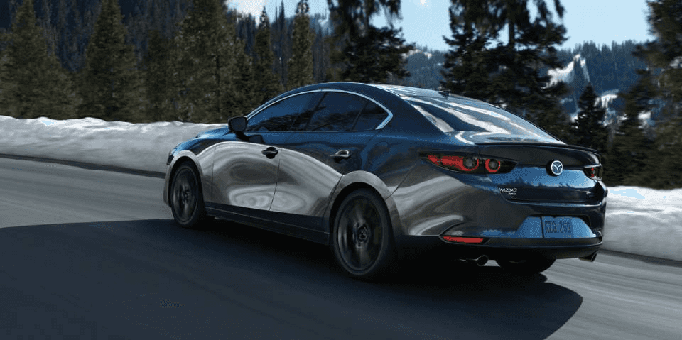 Pre-owned Mazda vehicle on the road