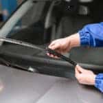 Mazda service technician changing windshield wipers