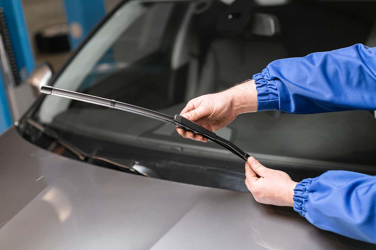 Mazda service technician changing windshield wipers