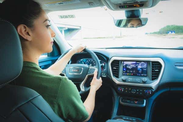 Female driving 2020 GMC Acadia