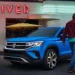 A blue 2022 Volkswagen Taos is shown at a diner after visiting an Ohio Volkswagen dealer.