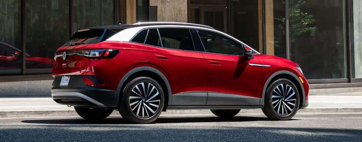 A red 2023 Volkswagen ID.4 Pro S Plus is shown from the side.