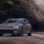 A grey 2022 VW Golf GTI Autobahn is shown from the front at an angle after leaving a dealer that handles VW leasing near Cleveland.