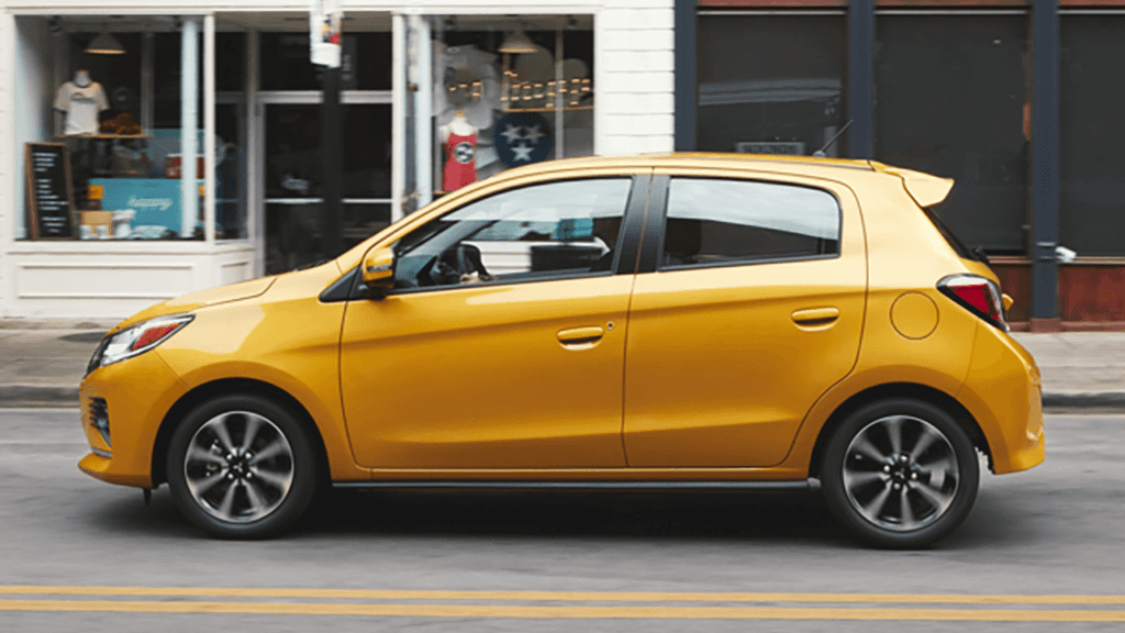 Yellow 2022 Mitsubishi Mirage Driving Down Street