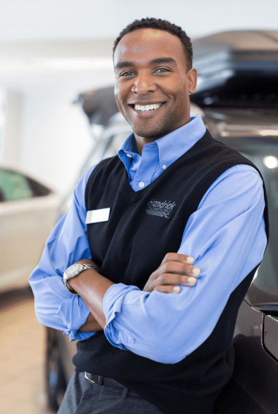 An exterior shot of a Honda dealership in the day.
