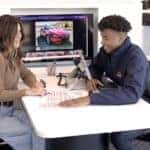 Mazda Client Advisor at a desk with a customer.