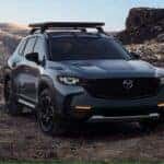 exterior image of mazda cx-50 with roof rack sitting in desert