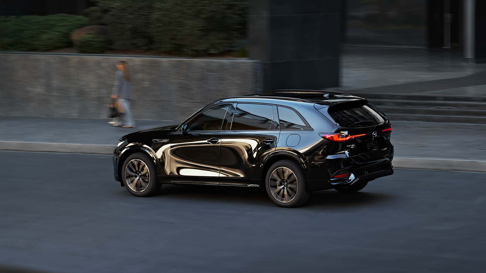 Image of Mazda CX-70 driving down the road.