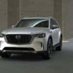 A parked white Mazda CX-90