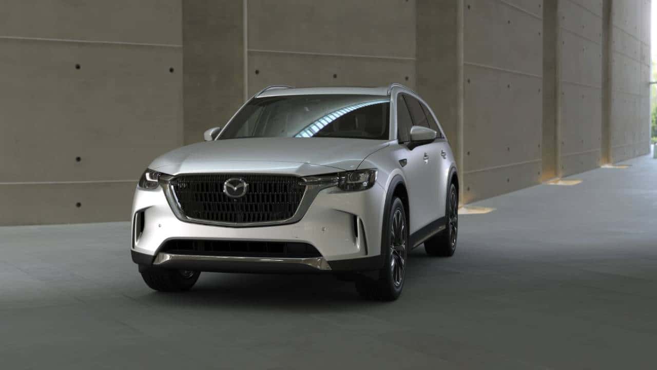 A parked white Mazda CX-90