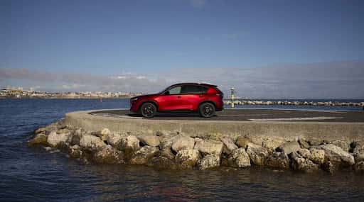Red Mazda CX-5 by the ocean