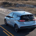 2023 Chevy Bolt EV driving down the road