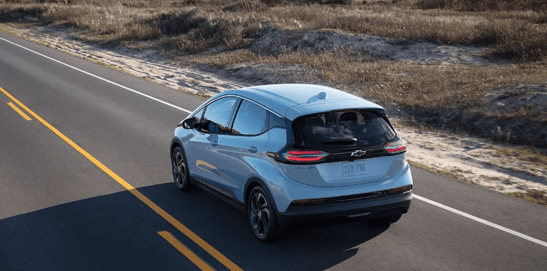 2023 Chevy Bolt EV driving down the road