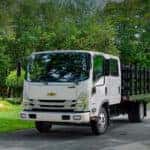 The 2023 Chevrolet Low Cab Forward Truck driving down a suburban street