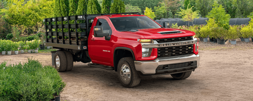 The 2023 Chevrolet Silverado 3500 Chassis Cab parked in a field
