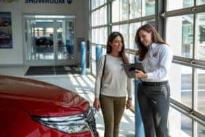 Customer looking at Chevy Service coupons