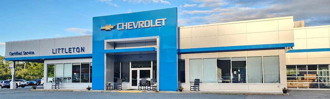 An exterior shot of a Chevrolet dealership at night.