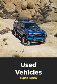 Used blue vehicle driving off road