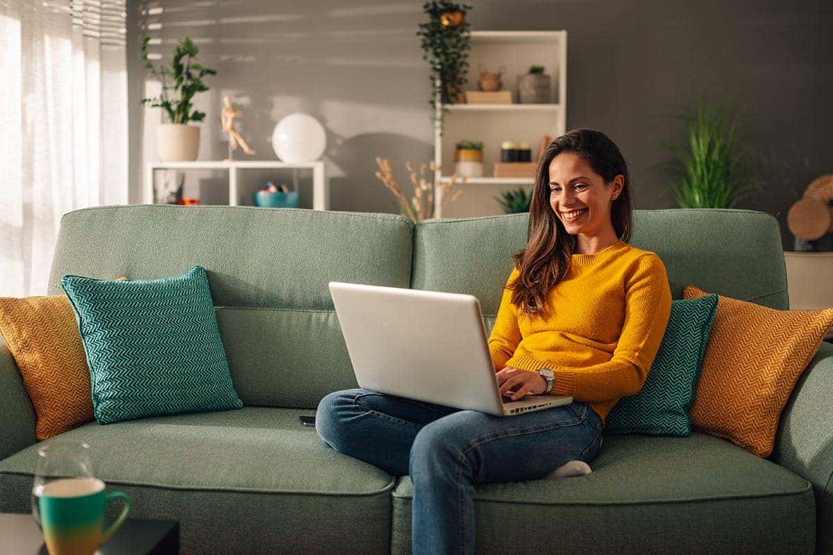 Woman on laptop filling out credit application