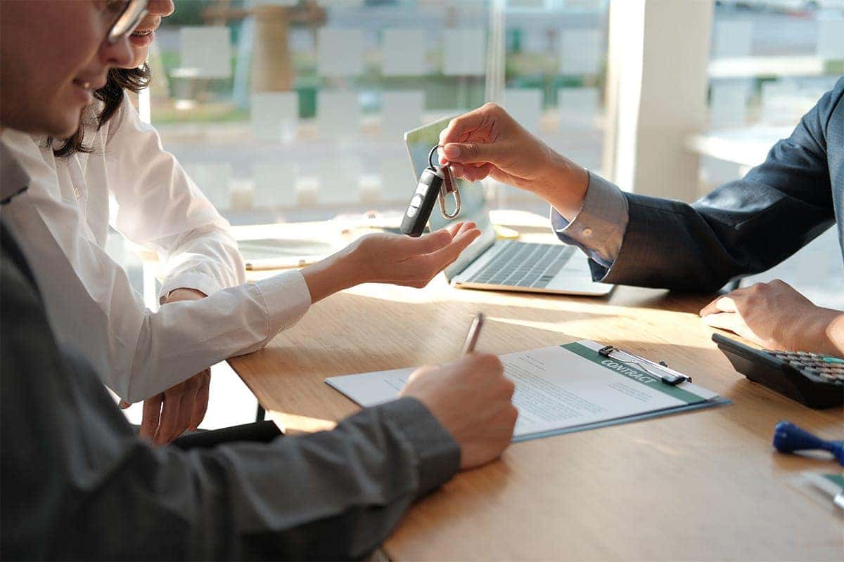 filling out paperwork and accepting keys