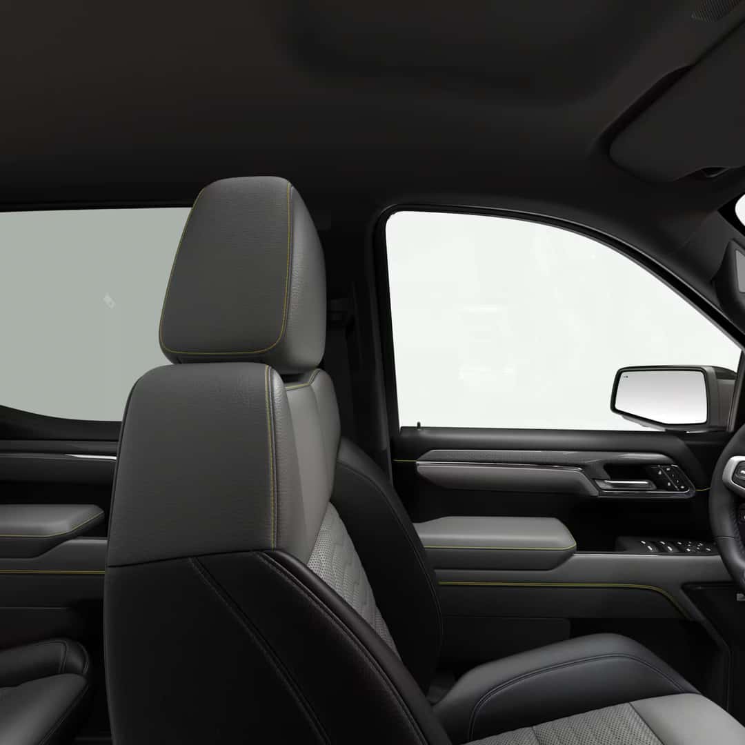 the front drivers side showcasing gray leather interior with yellow stitching