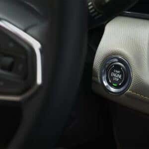Close-up of the push-button start feature in the 2025 Chevrolet Trailblazer, set within a modern dashboard with premium stitching and sleek design.