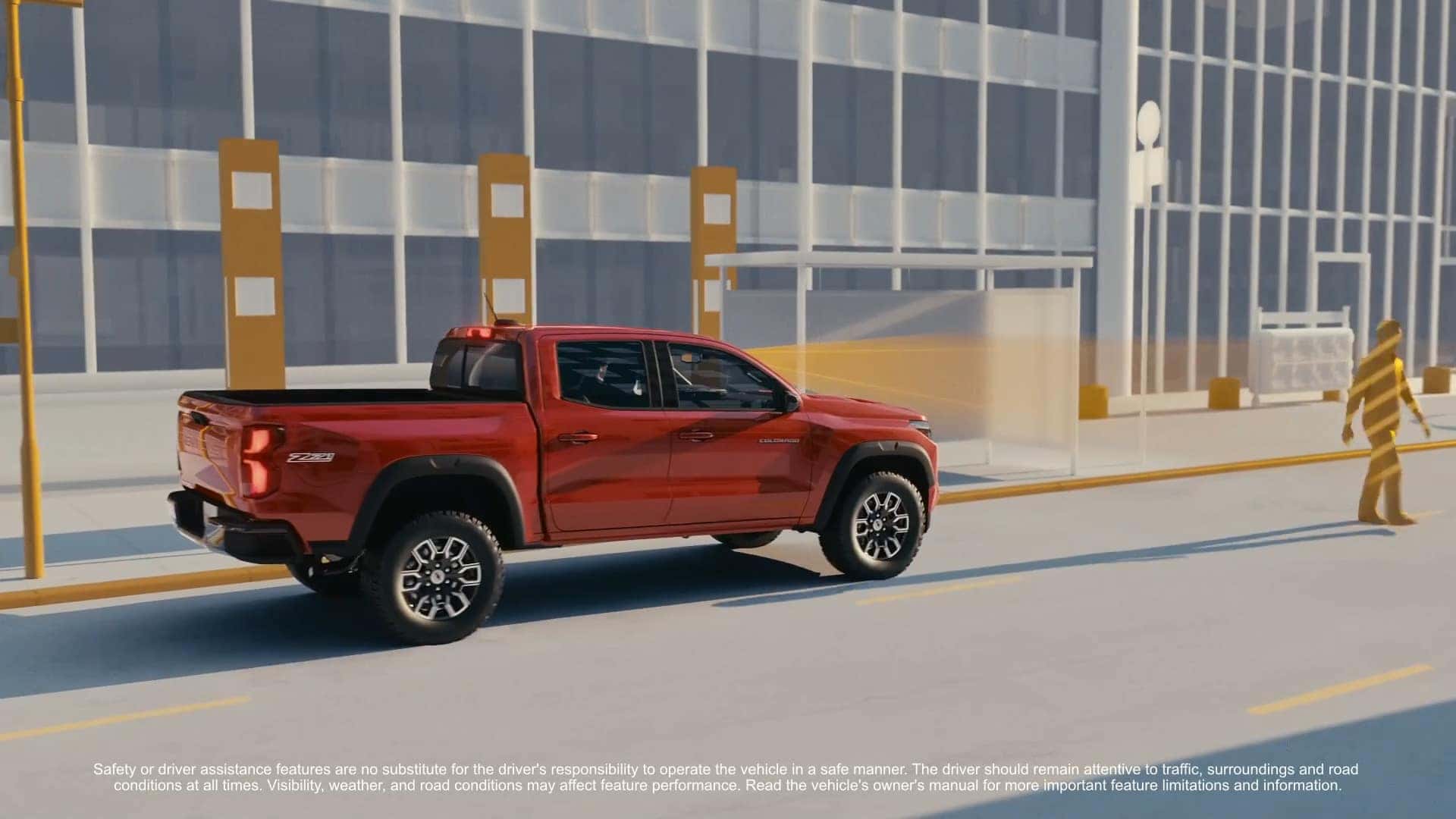 A red pickup truck using advanced safety systems with sensors monitoring the road ahead and surrounding environment on a city street.