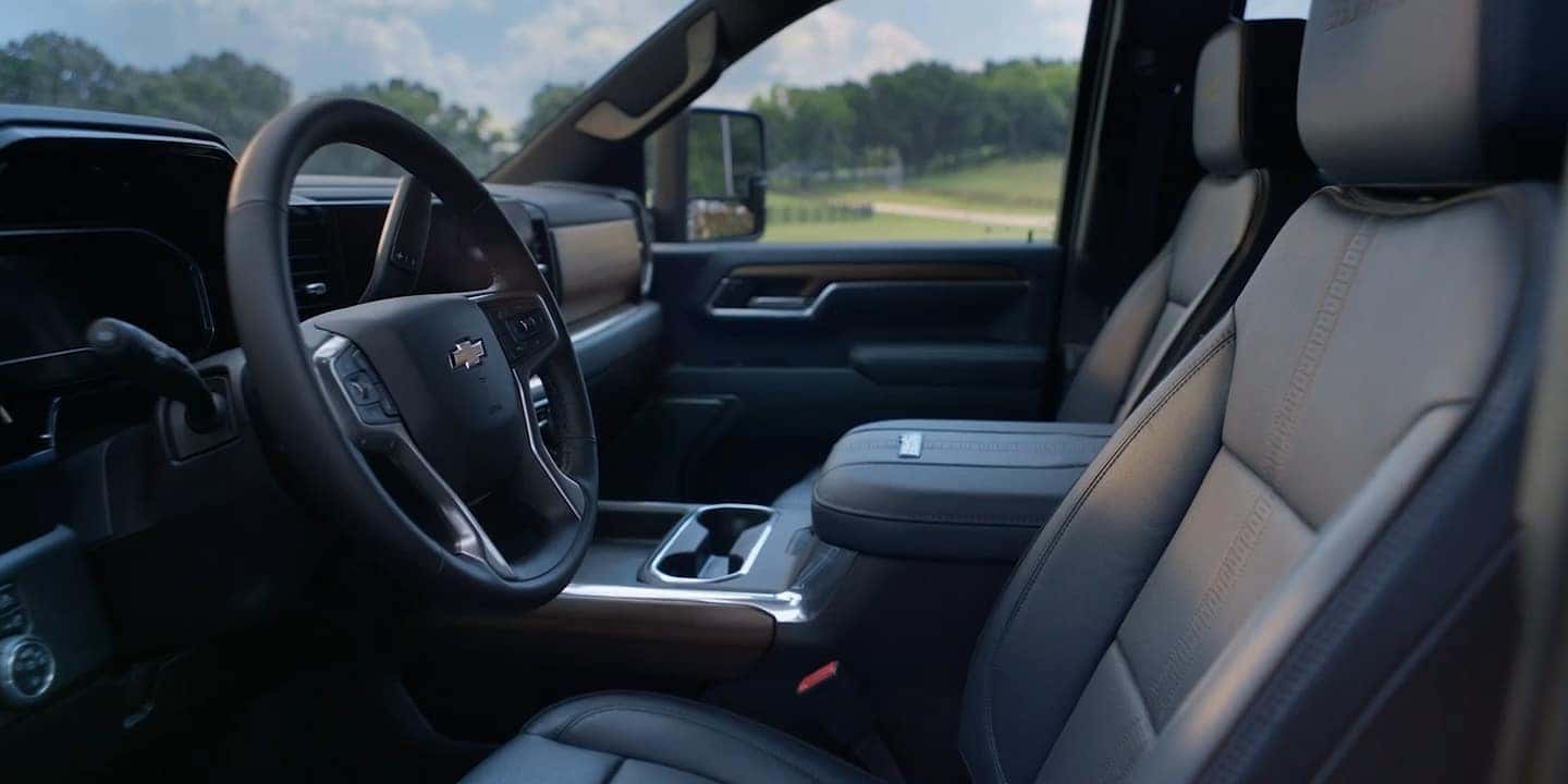 front interior view of a silverado hd truck with black leather interior