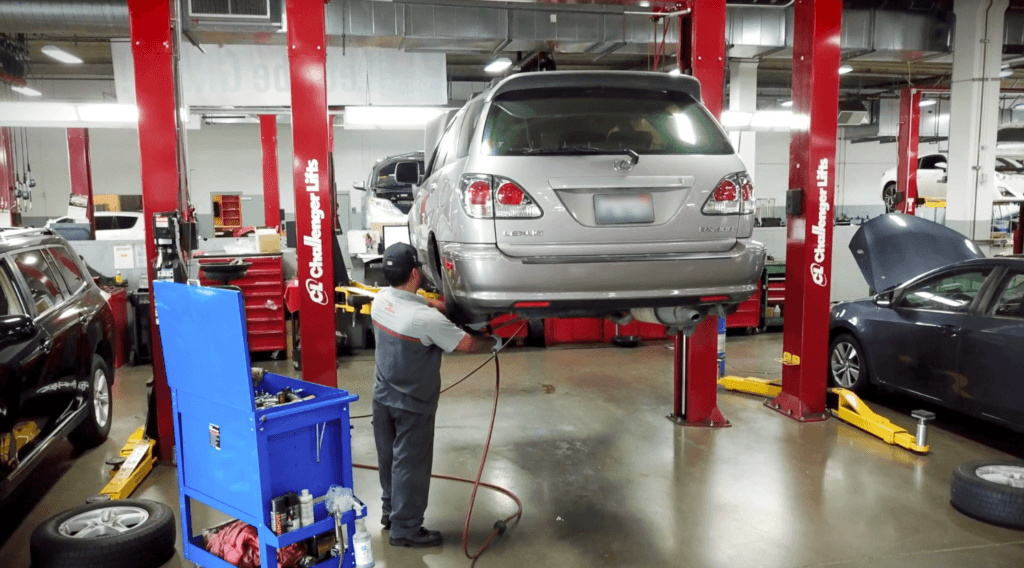 Technician Changing Brakes