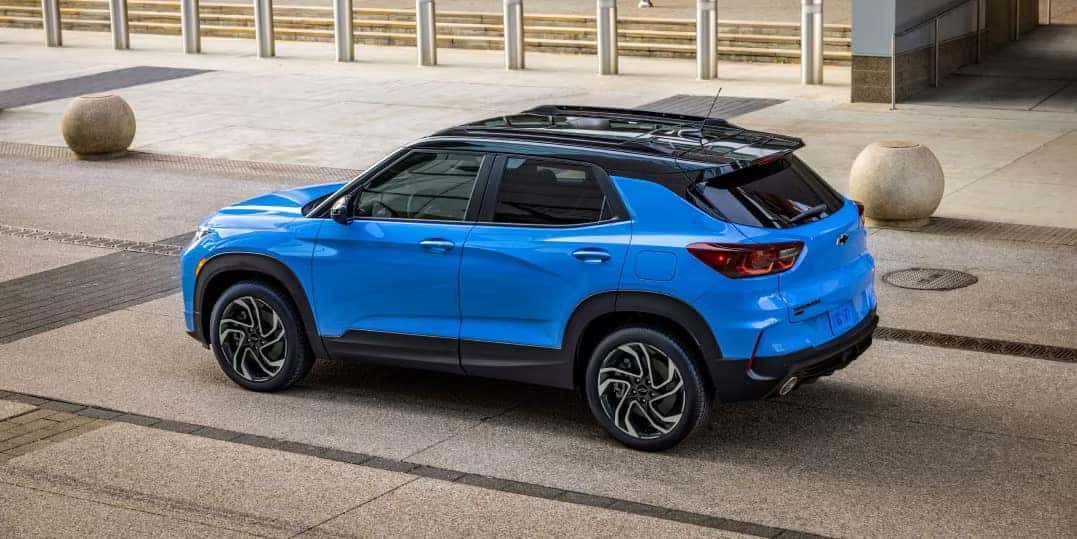 a blue car parked on a road