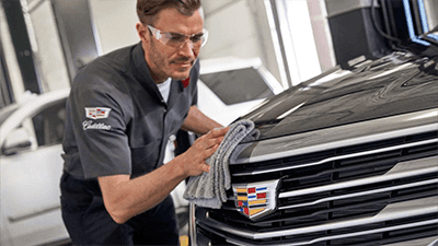 man cleaning car