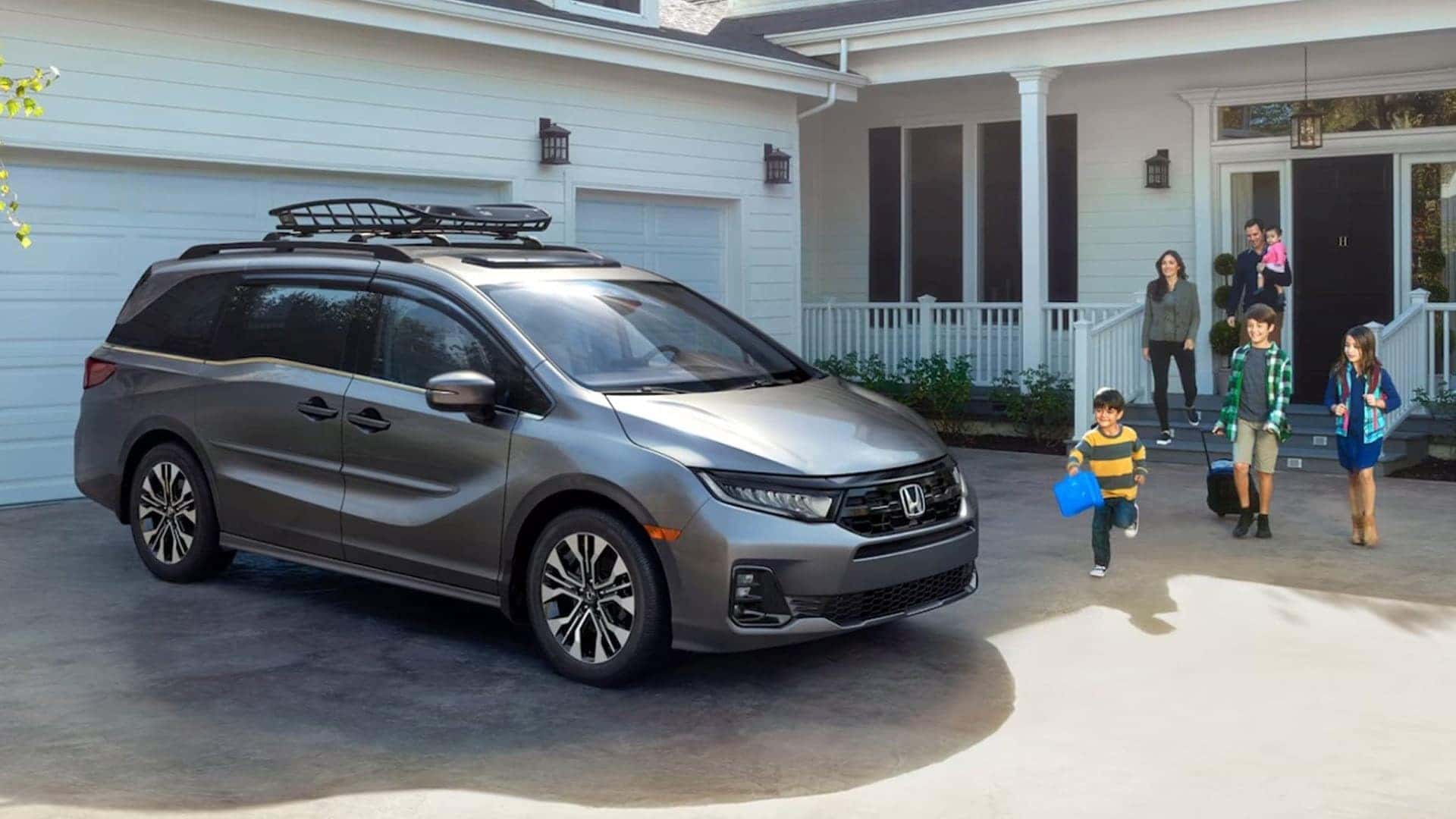 2025 odyssey with family in driveway