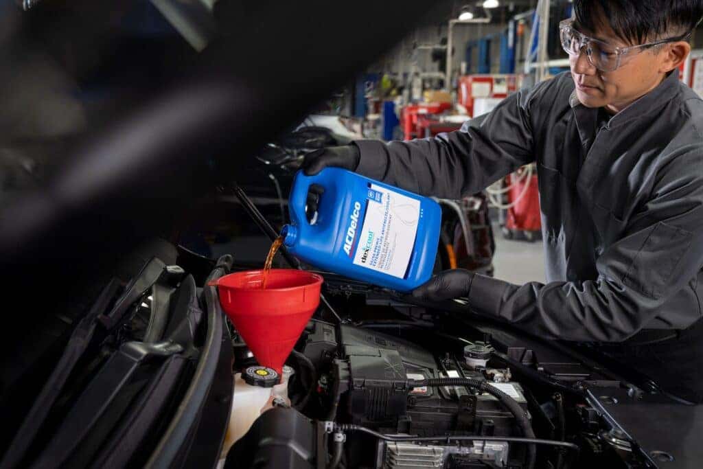 Coolant being poured into a vehicle