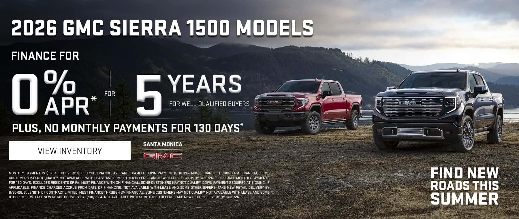 Promotional banner for the 2026 GMC Sierra 1500 lineup. Two GMC pickup trucks, one red and one black, are parked in a rugged outdoor setting with mountains and a lake in the background under a cloudy sky. Large text highlights a financing offer of 0% APR for 5 years for well-qualified buyers, along with no monthly payments for 130 days. A “View Inventory” button appears on the left, with the Santa Monica GMC logo below. The slogan “Find New Roads This Summer” is displayed in the lower-right corner, and financing disclaimer text runs along the bottom of the banner.