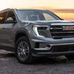 GMC Acadia parked in front of sunset