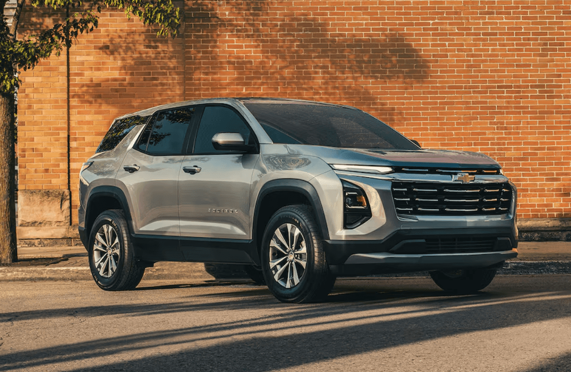 Equinox parked in front of Brick wall