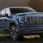 Gmc Sierra parked in green field