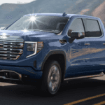 Blue Sierra driving across bridge