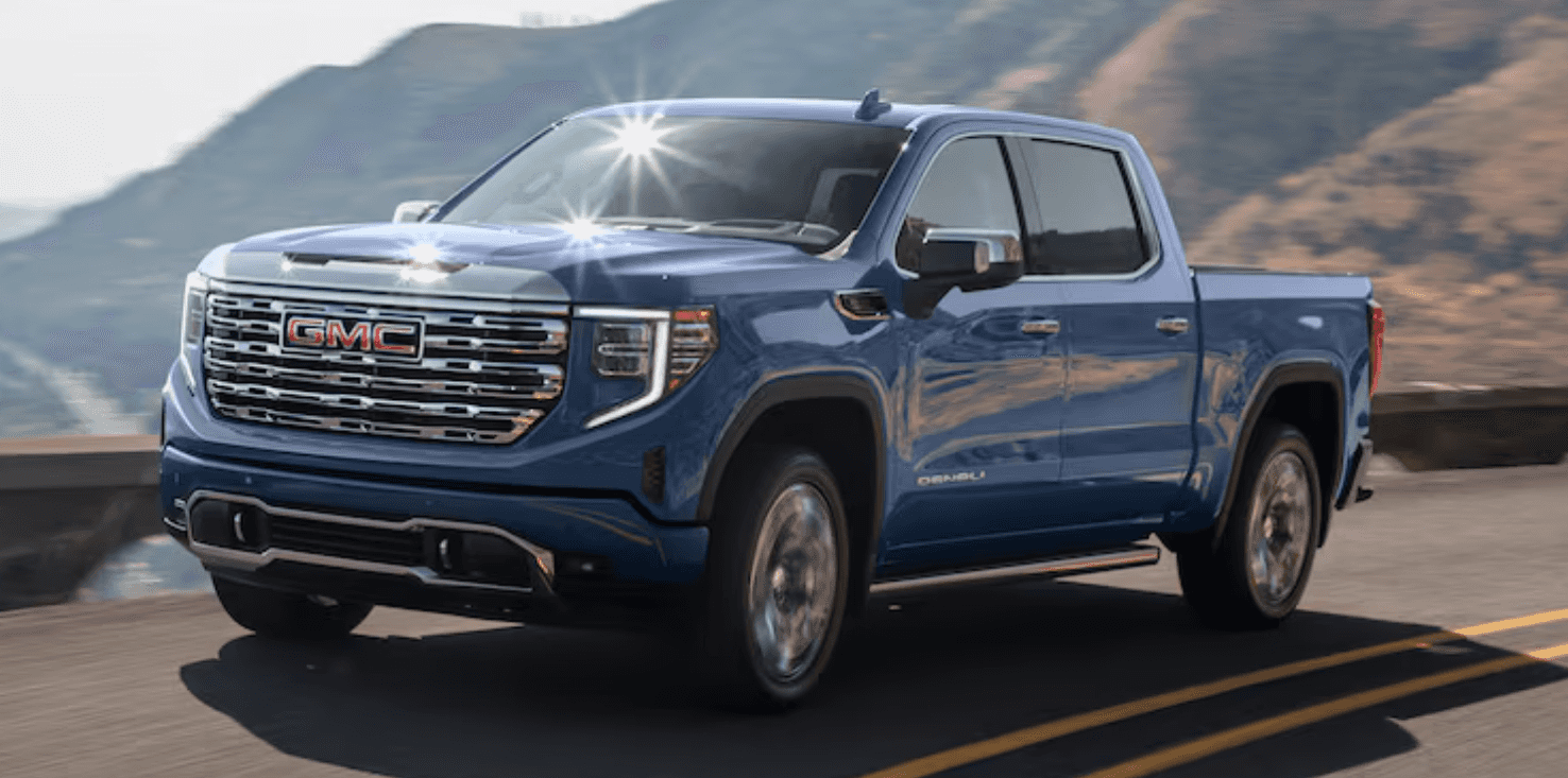 Blue Sierra driving across bridge