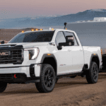Sierra HD in white towing a trailer