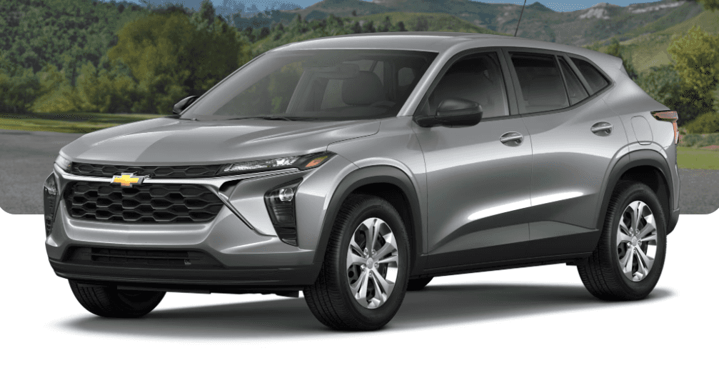 Chevrolet Trax parked in fornt of forest