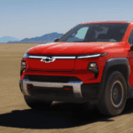Orange Chevrolet pickup truck in the desert